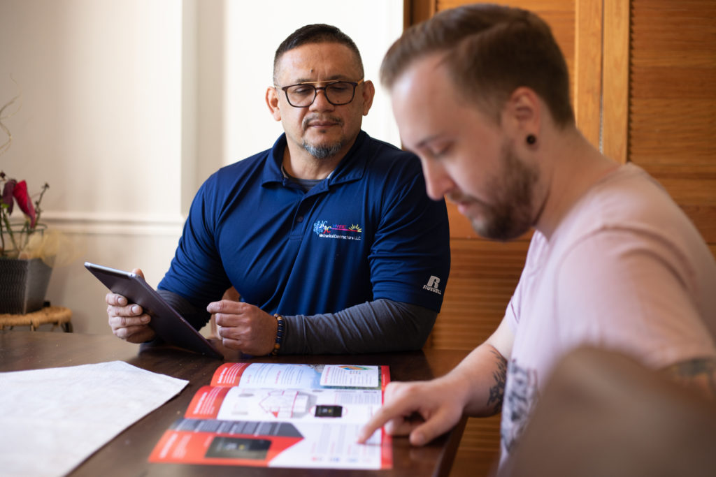 One of our employees helps a customer with financing.